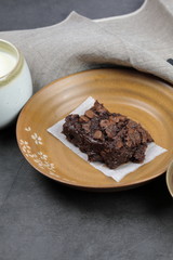 Homemade Chewvy Brownie with a cup of milk.