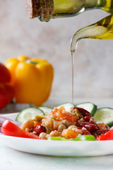 Quinoa salad with vegetables and olive oil. Vegan food.