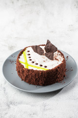 Delicious cake on plate on table on marble background. Wallpaper for pastry cafe or cafe menu. vertical.