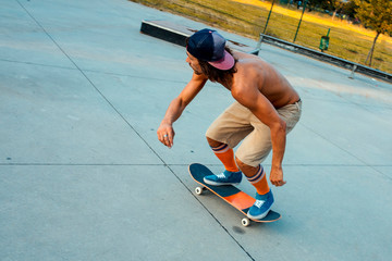 Skateboarder with high socks riding skateboard in a skate park