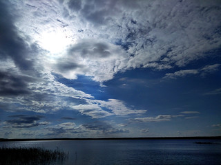 Clouds covered the sun over the lake