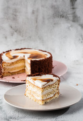 Delicious victoria sponge cake with white cream on plate on table on marble background. Wallpaper for pastry cafe or cafe menu. vertical.