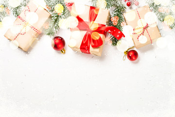 Christmas background with fir tree and decorations on white.