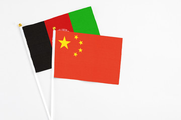 China and Afghanistan stick flags on white background. High quality fabric, miniature national...