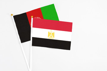 Egypt and Afghanistan stick flags on white background. High quality fabric, miniature national...