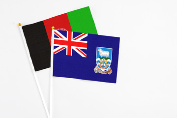 Falkland Islands and Afghanistan stick flags on white background. High quality fabric, miniature...