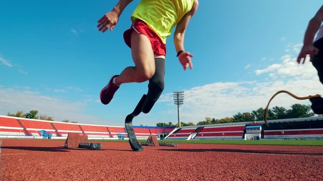 Two paralympians start running in slow motion