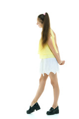 A cheerful little girl is dancing.