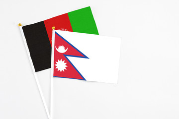 Nepal and Afghanistan stick flags on white background. High quality fabric, miniature national...