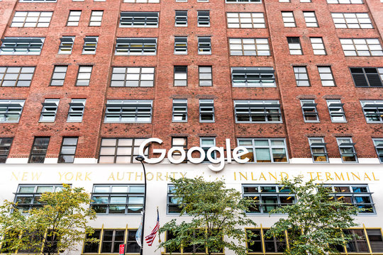 New York City, USA - October 30, 2017: Google company office green sign in downtown, lower Chelsea neighborhood district Manhattan NYC, with nobody, scaffold construction
