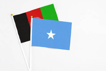 Somalia and Afghanistan stick flags on white background. High quality fabric, miniature national...
