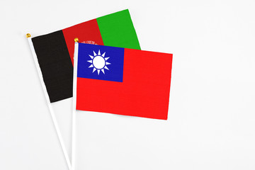 Taiwan and Afghanistan stick flags on white background. High quality fabric, miniature national...