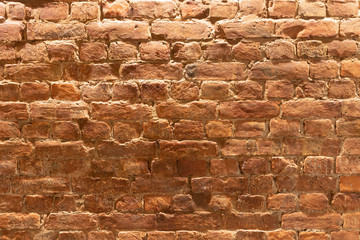 red brick wall overhead light