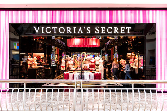 Tysons Corner, USA - January 26, 2018: Victoria's, Victorias Secret women lingerie specialty underwear store, storefront, shop entrance with people walking in shopping mall in Virginia
