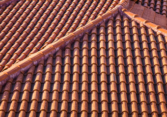 Red tile roof in Albania, mediterranean architecture abstract background texture.