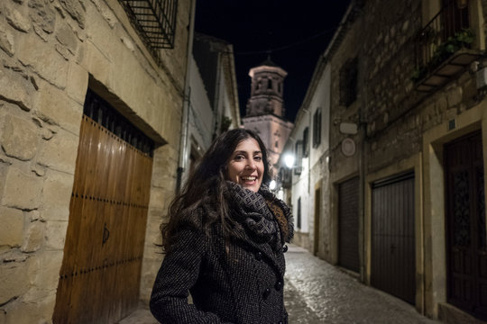 wide angle iage of woman in european old streets