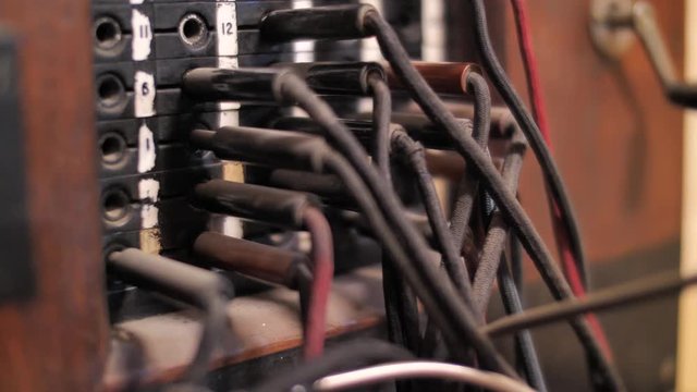 Pulling plug from socket of retro telephone exchange 