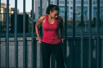 Fototapeta premium Pulling sports shirt down outdoors stock photo