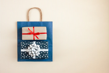 blue bag with wrapped gifts top view