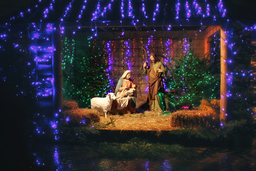 Christmas Manger scene with figures including Jesus, Mary, Joseph, sheep and magi. Christmas...