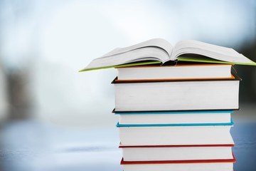 Books collection in pile on  background.