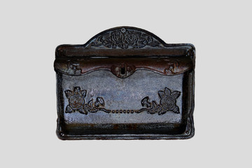 Antique metal post box with floral decorations isolated