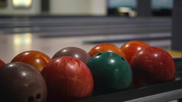 Bowling balls on the background of bowling alleys in a bowling club. Close-up
