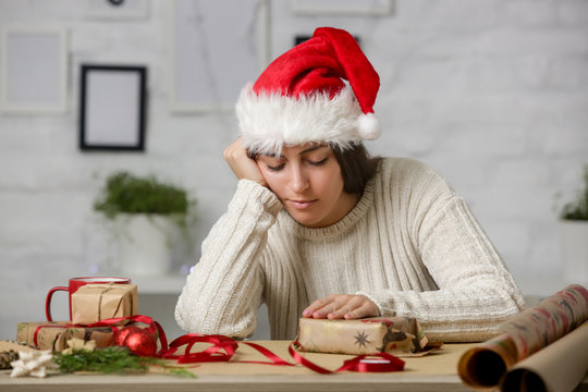 Depressed Frustrated Woman Wrapping Christmas Gift Boxes, Winter Holiday Stress Concept