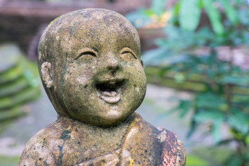 Laughing child buddha statue