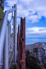 Fototapeta premium Old and new hand rails at The Gobbins cliff path, Causeway coastal route, Islandmagee, County Antrim, Northern Ireland
