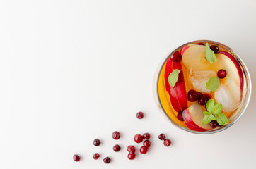 Spiced apple mocktail with mint and cinnamon. White background