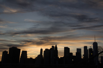 Fototapeta na wymiar Newyork skyline at sunset in silhouette