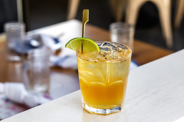 fresh lime alcohol cocktail at a restaurant interior 