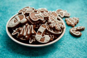 Delicious fresh Christmas decorated gingerbread cookies placed in wooden crate