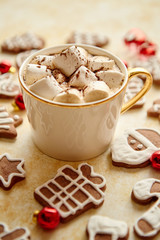 Cup of hot chocolate and Christmas shaped gingerbread cookies