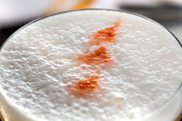 fresh orange alcohol cocktail at a restaurant interior 