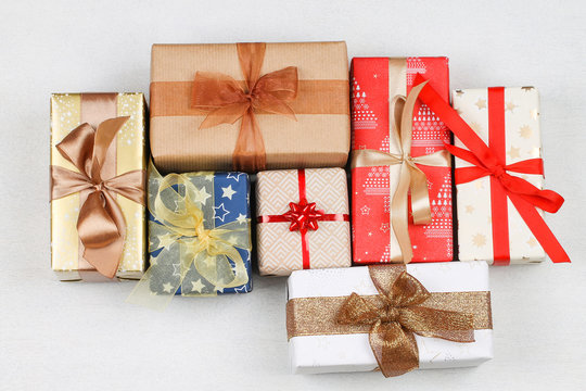 The gift boxes of different colors with bows. Christmas.