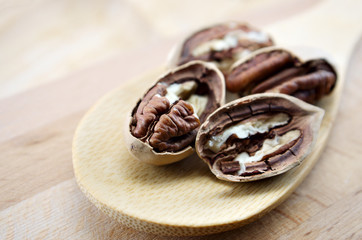 pecan close-up macro high resolution on wooden background