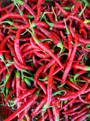 Shiny red peppers background