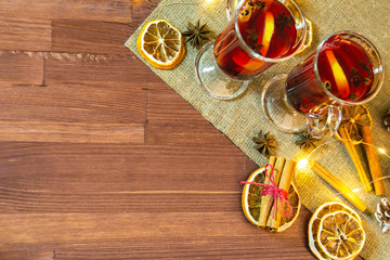 mulled wine glasses and ingredients on a wooden table