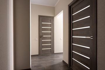 Corridor in a small apartment, closed doors - obrazy, fototapety, plakaty