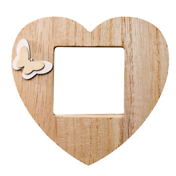 wooden photo frame in the form of a heart with free space, copy space, mock up, isolated on white background