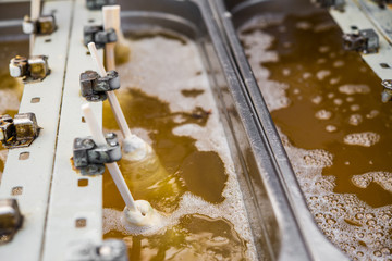 Traditional South Korean corn dogs frying in hot oil at a street food market
