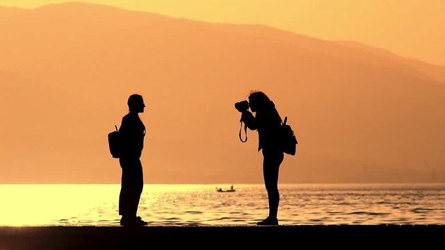 silhouette of girls taking pictures	