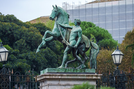 Clodt horses sculpture in front of the garden of Royal Palace in Naples, Italy