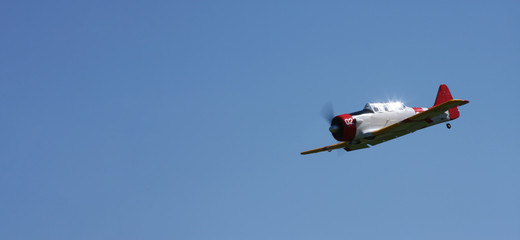 ww 2 plane in flight with blue sky