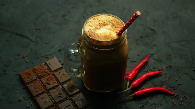 Beverage in mug and chocolate