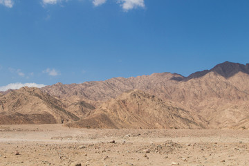 Fototapeta na wymiar Red mountains and blue sky. Egypt, the Sinai Peninsula.