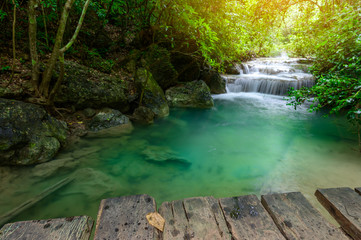 Naklejka premium A beautiful waterfall deep in the tropical forest steep mountain adventure in the rainforest.