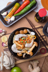 cooking spicy instant noodles soup with shrimps and  mushrooms. flat lay.